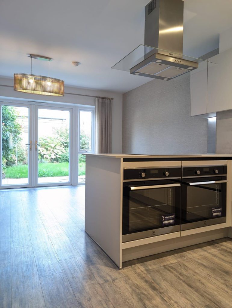 A kitchen featuring a stove and oven, showcasing a functional cooking space with modern appliances.
