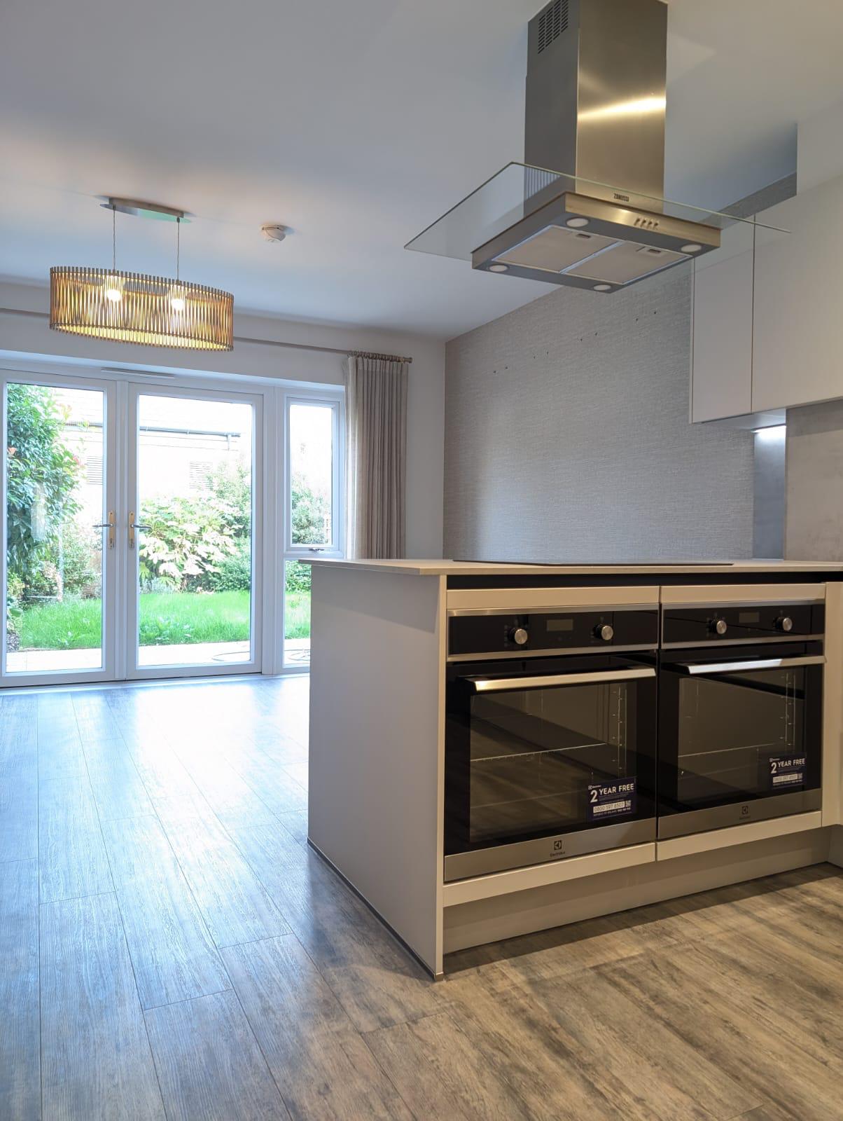 A kitchen featuring a stove and oven, showcasing a functional cooking space with modern appliances.